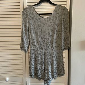Gorgeous beaded formal romper with a low back